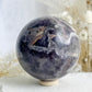 DREAM AMETHYST SPHERE APPROX 7.9CM. STONED AND SAGED AUSTRALIA.