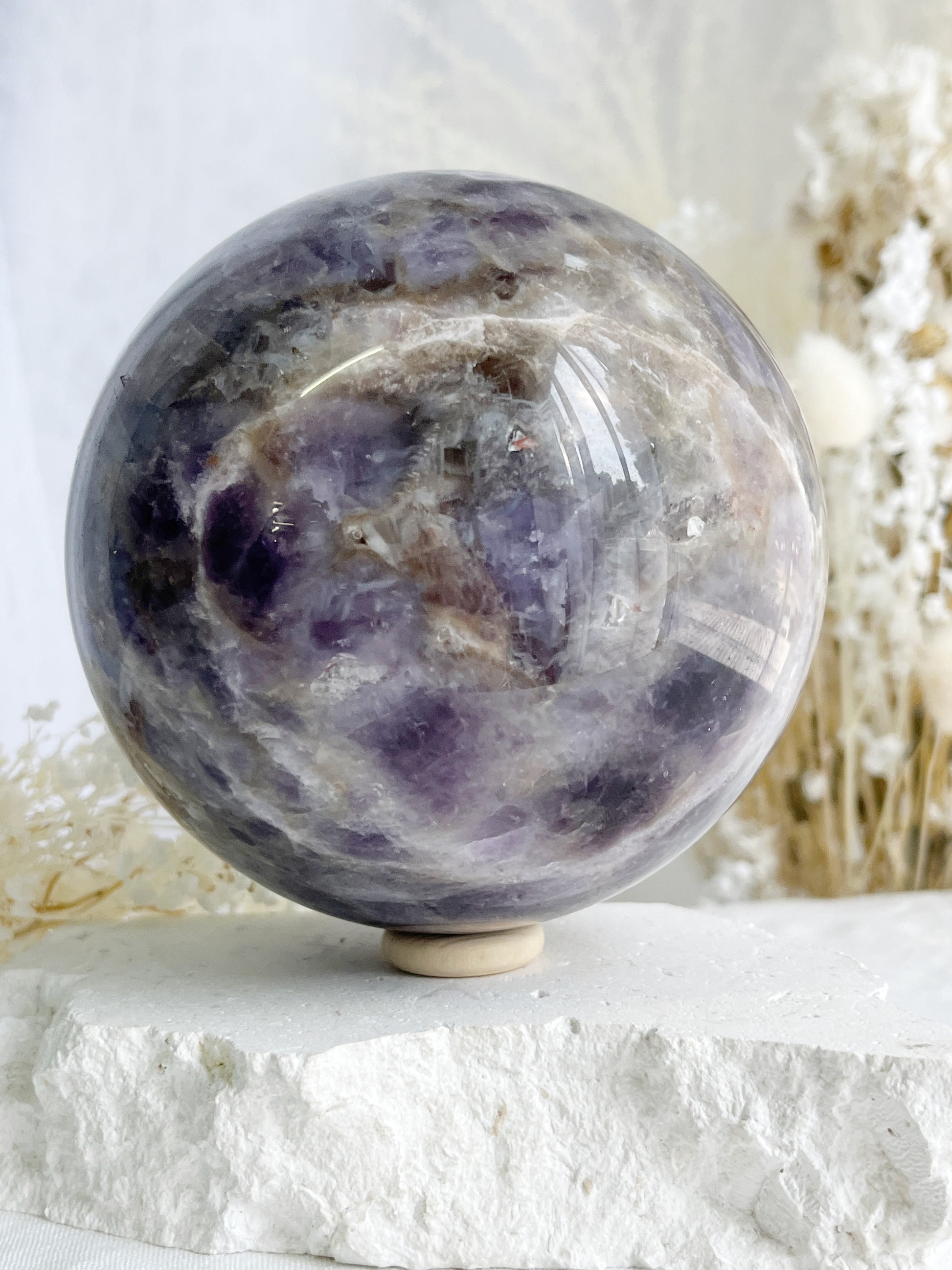 DREAM AMETHYST SPHERE APPROX 11CM. STONED AND SAGED AUSTRALIA.