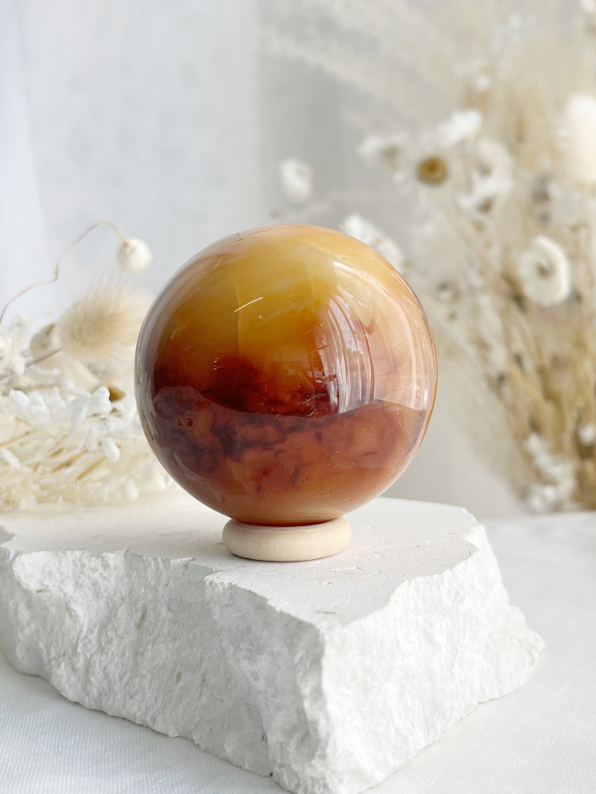 CARNELIAN SPHERE APPROX 5.5CM. STONED AND SAGED AUSTRALIA.