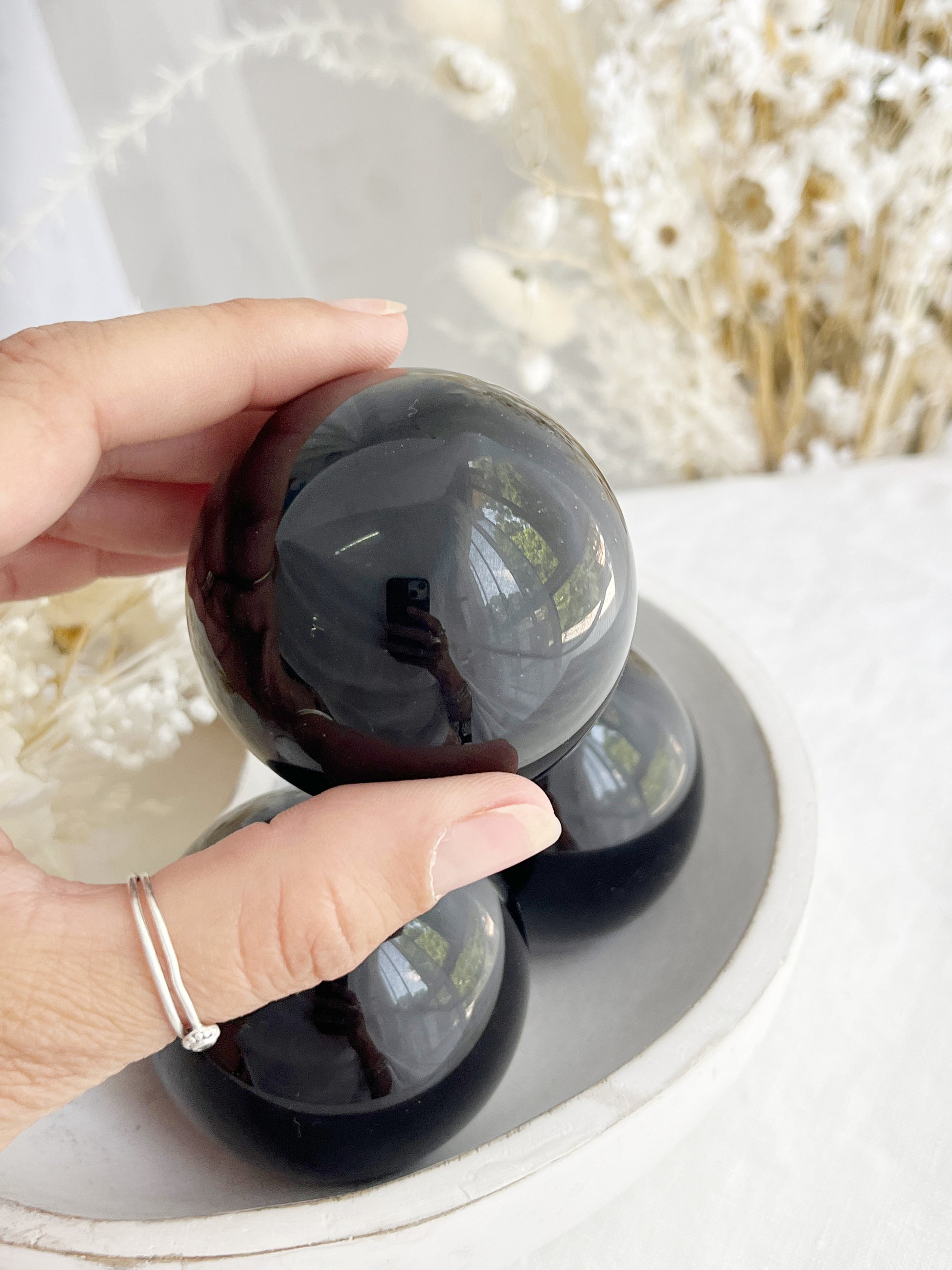 BLACK OBSIDIAN SPHERE APPROX 5.8CM. STONED AND SAGED AUSTRALIA.