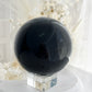 BLACK OBSIDIAN SPHERE. APPROX 9.5 CM. STONED AND SAGED AUSTRALIA.