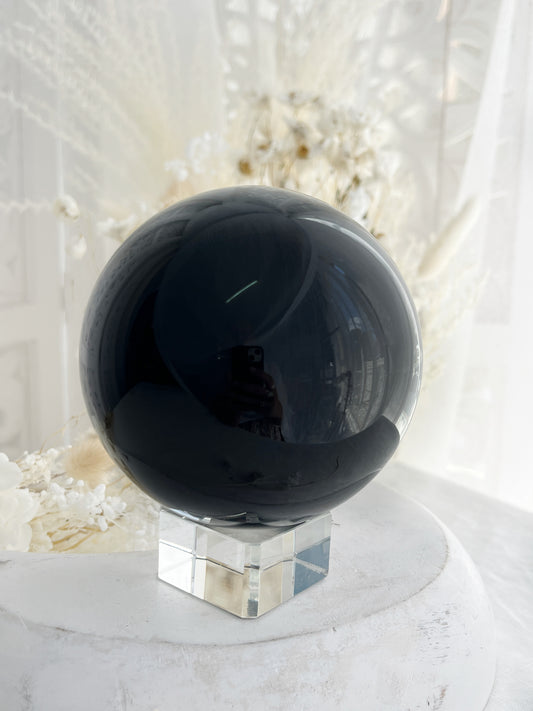 BLACK OBSIDIAN SPHERE. APPROX 9.5 CM. STONED AND SAGED AUSTRALIA.