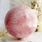 ROSE QUARTZ SPHERE APPROX 10CM. STONED AND SAGED AUSTRALIA.