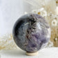 DREAM AMETHYST SPHERE APPROX 7CM. STONED AND SAGED AUSTRALIA.