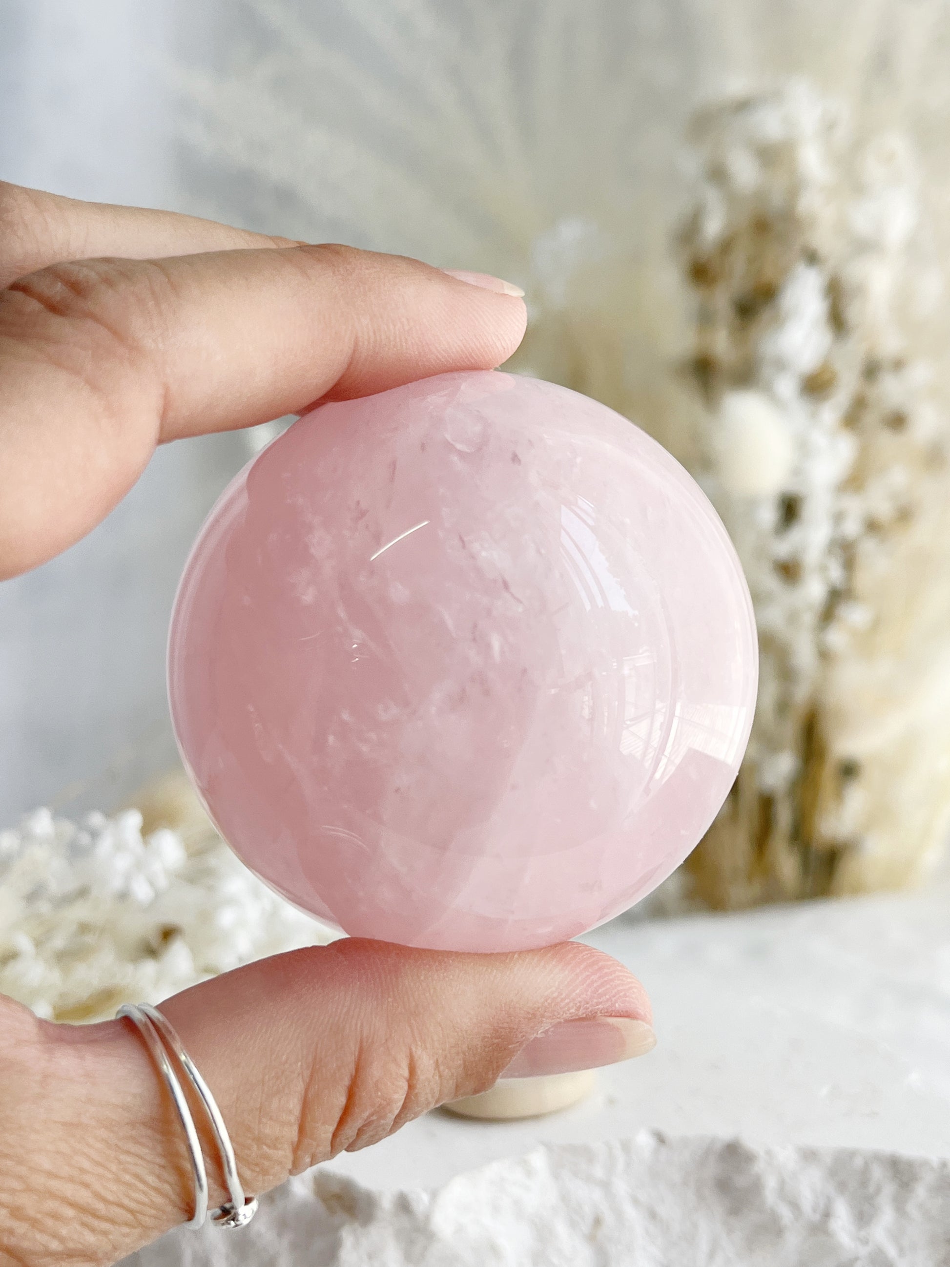 ROSE QUARTZ SPHERE APPROX 5.7CM. STONED AND SAGED AUSTRALIA.