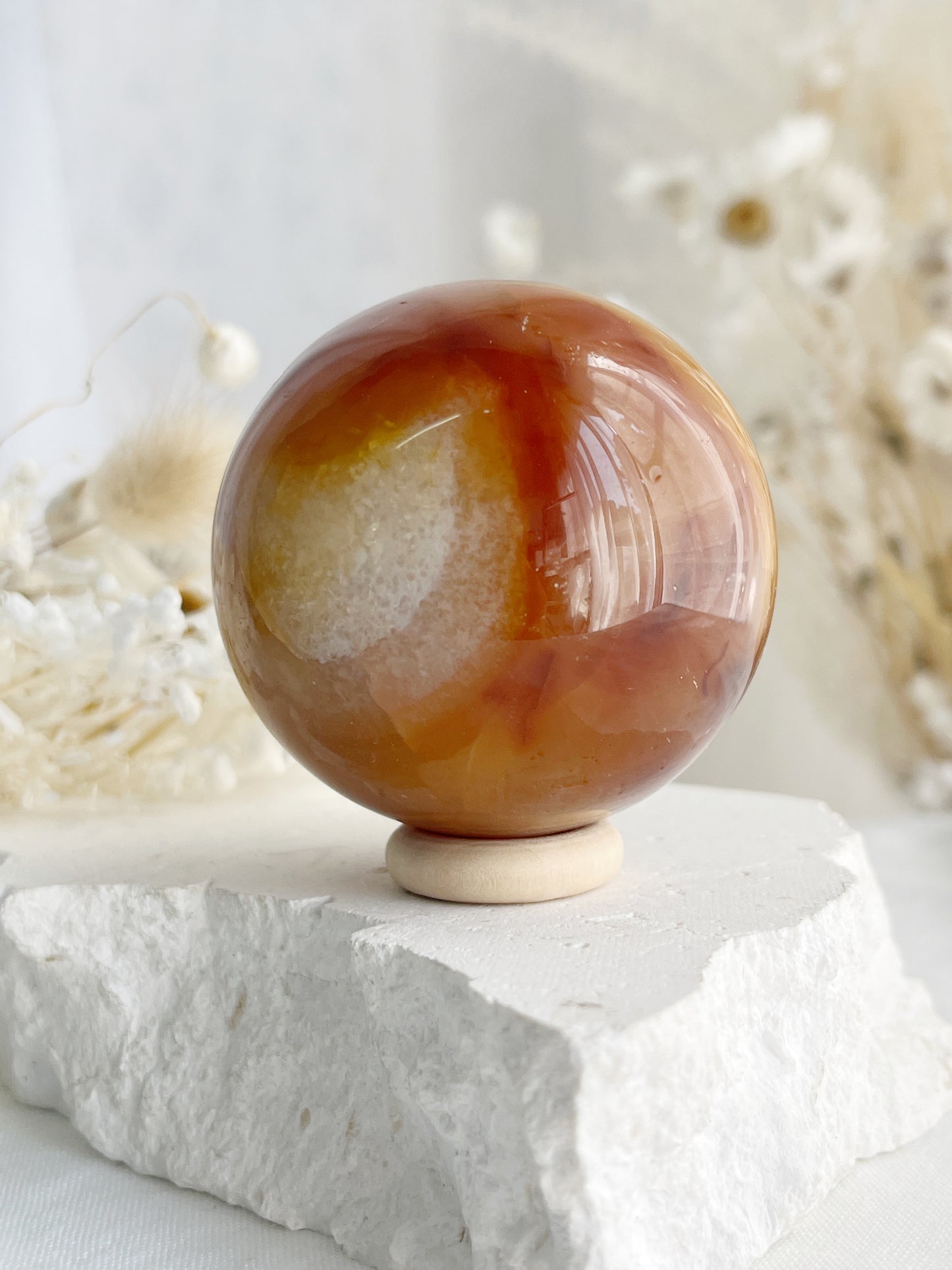 CARNELIAN SPHERE APPROX 5.5CM. STONED AND SAGED AUSTRALIA.