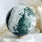 MOSS AGATE SPHERE APPROX 9CM. STONED AND SAGED AUSTRALIA.