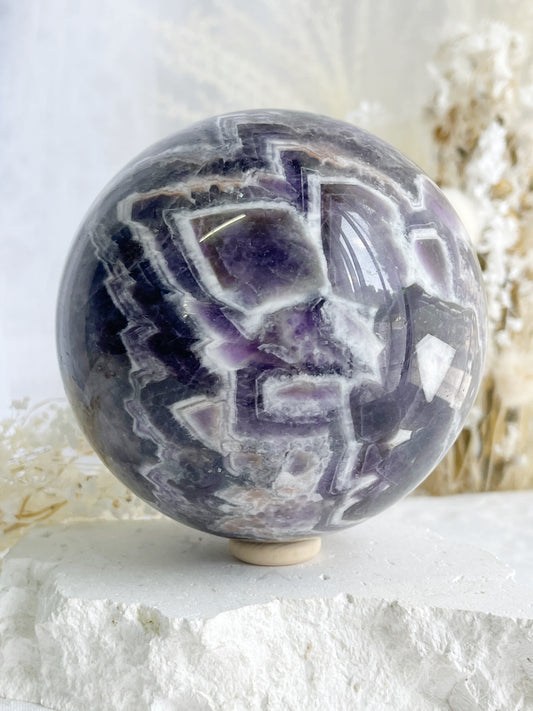 DREAM AMETHYST SPHERE APPROX 11CM. STONED AND SAGED AUSTRALIA.