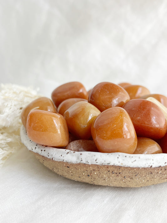 ORANGE AVENTURINE TUMBLE. STNED AND SAGED AUSTRALIA.