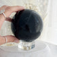 BLACK OBSIDIAN SPHERE. APPROX 9.5 CM. STONED AND SAGED AUSTRALIA.