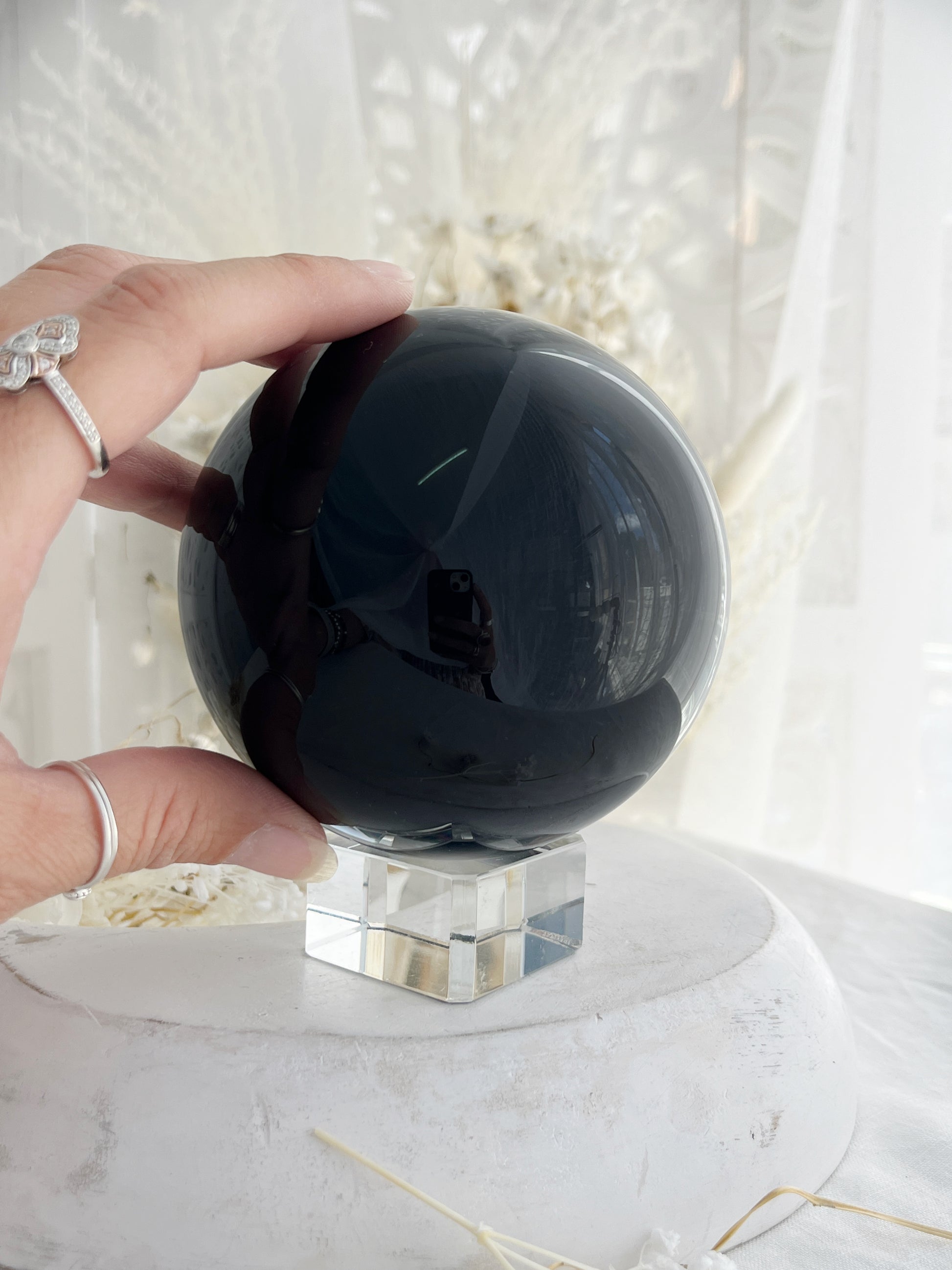 BLACK OBSIDIAN SPHERE. APPROX 9.5 CM. STONED AND SAGED AUSTRALIA.