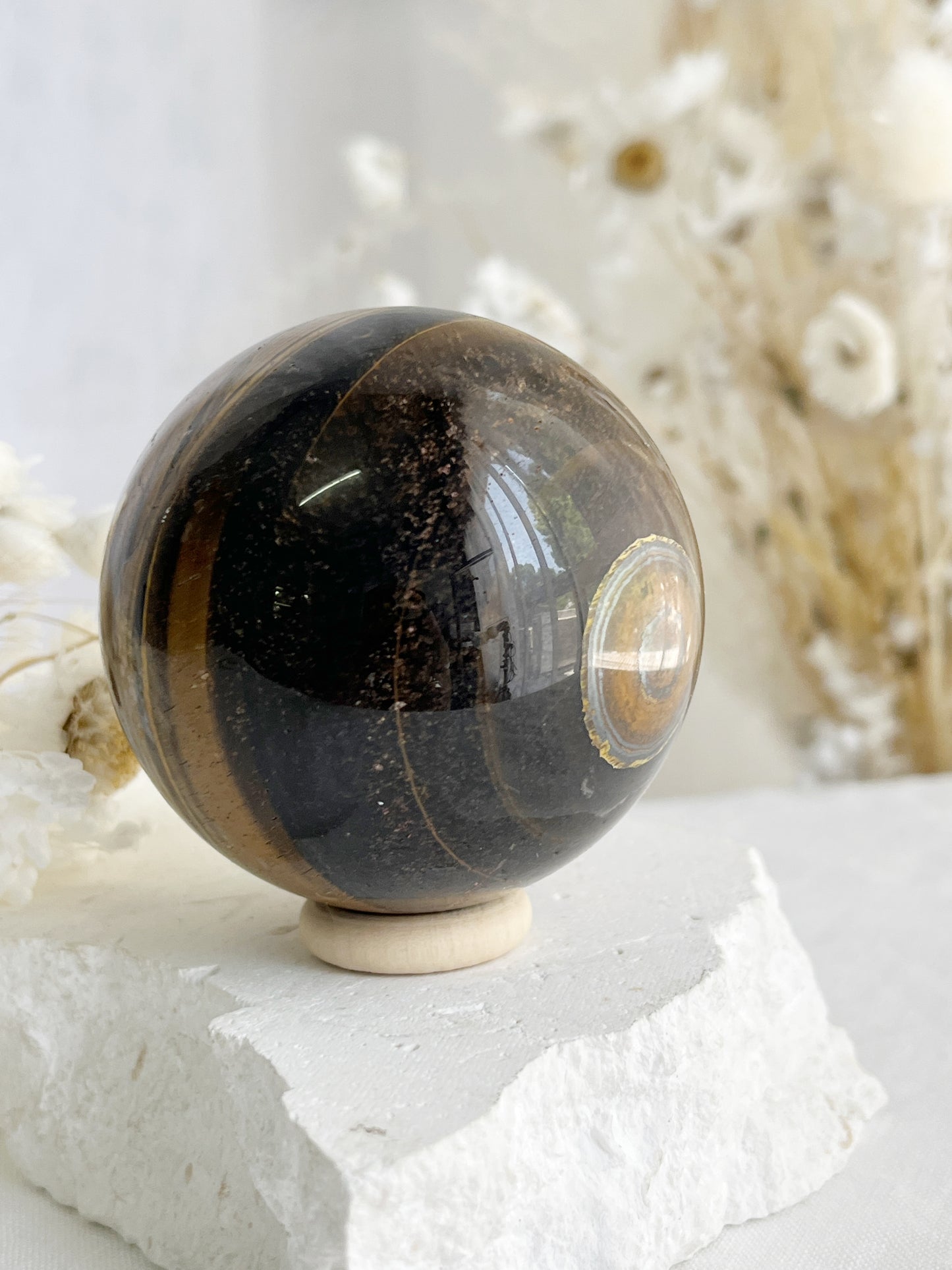 TIGERS EYE SPHERE APPROX 6.1CM. STONED AND SAGED AUSTRALIA.