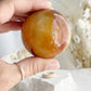 CARNELIAN SPHERE APPROX 5.5CM. STONED AND SAGED AUSTRALIA.