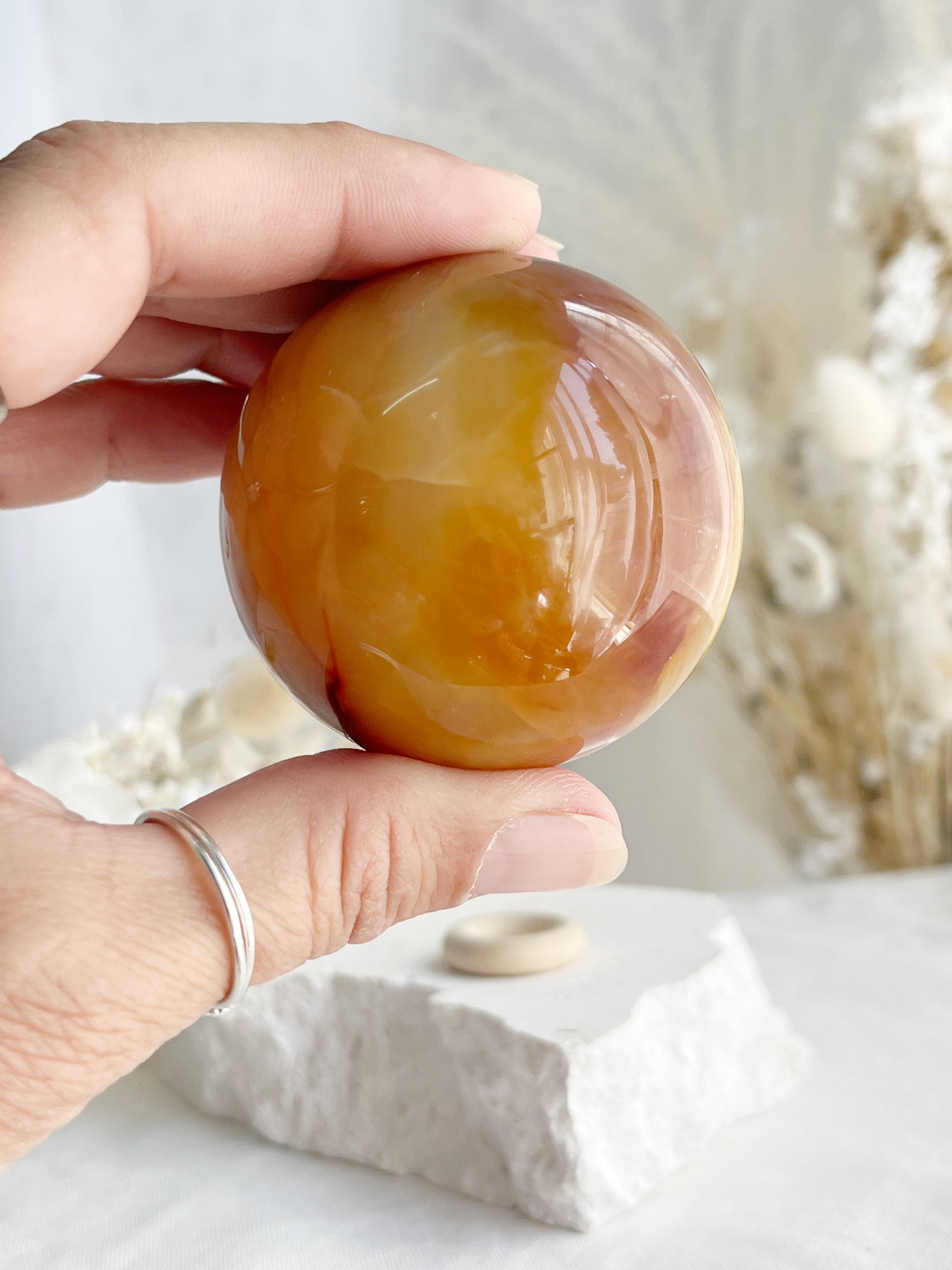 CARNELIAN SPHERE APPROX 5.5CM. STONED AND SAGED AUSTRALIA.