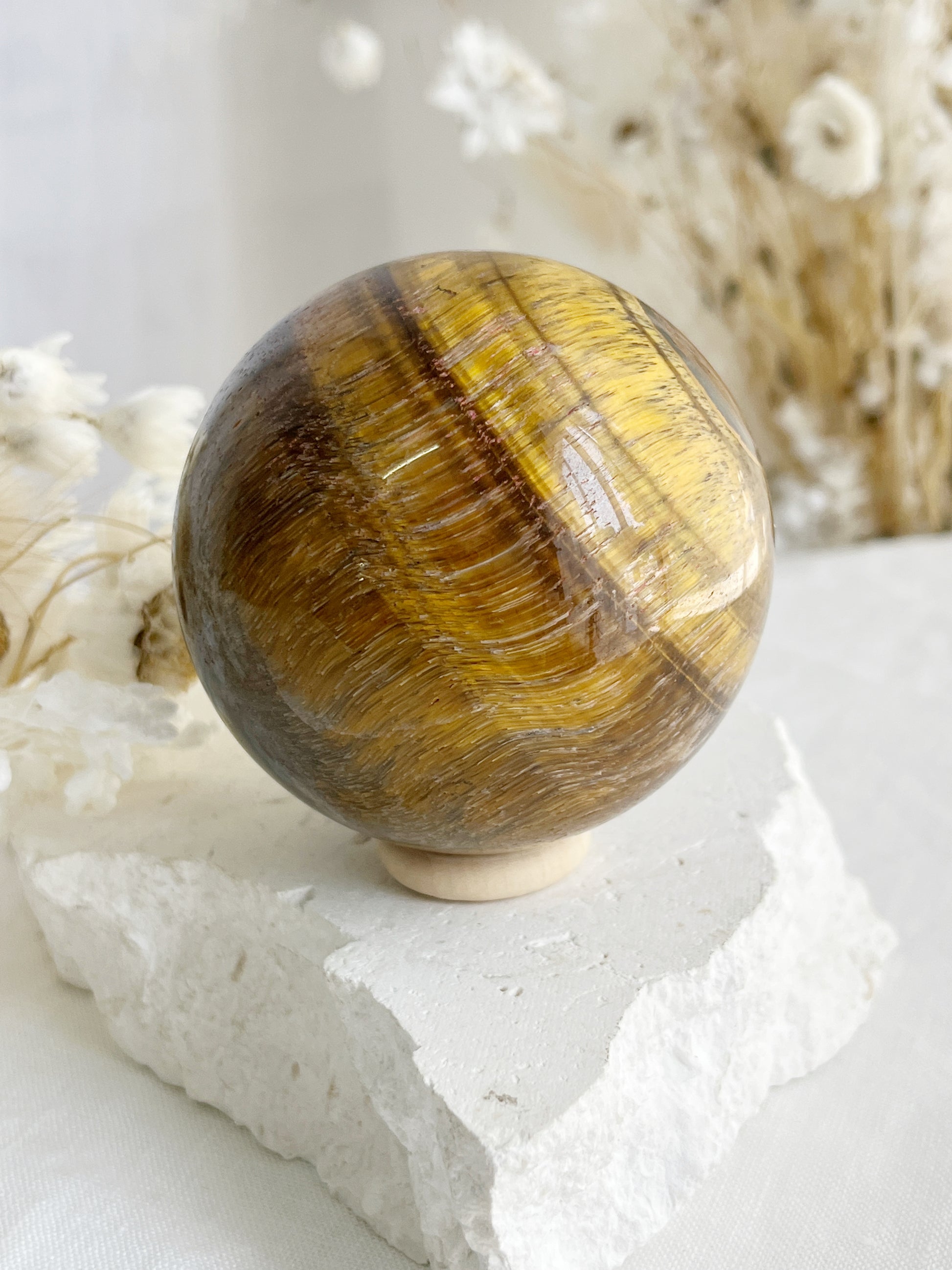 TIGERS EYE SPHERE APPROX 6.4CM. STONED AND SAGED AUSTRALIA.