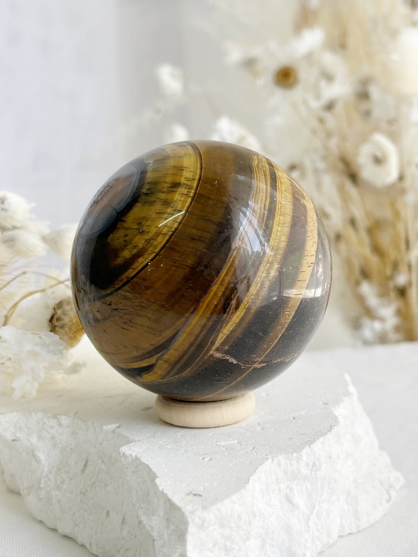 TIGERS EYE SPHERE APPROX 6.1CM. STONED AND SAGED AUSTRALIA.