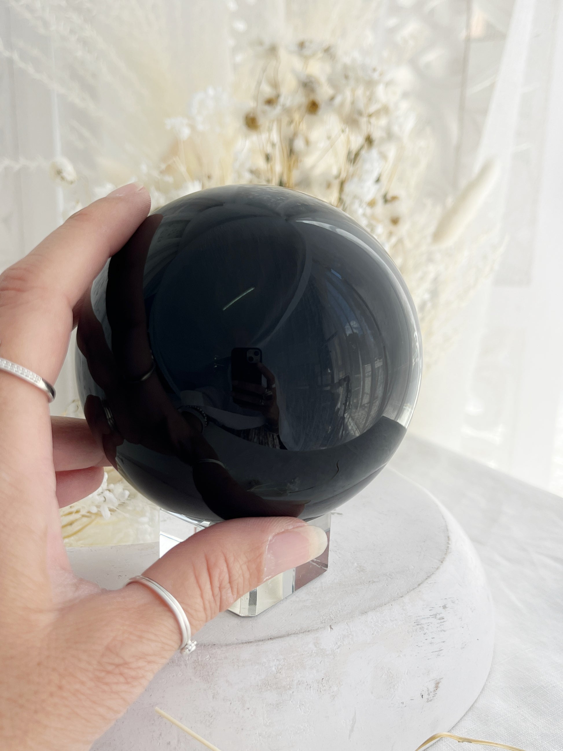 BLACK OBSIDIAN SPHERE. APPROX 9.5 CM. STONED AND SAGED AUSTRALIA.