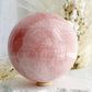 ROSE QUARTZ SPHERE APPROX 10CM. STONED AND SAGED AUSTRALIA.