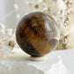 TIGERS EYE SPHERE APPROX 6.4CM. STONED AND SAGED AUSTRALIA.