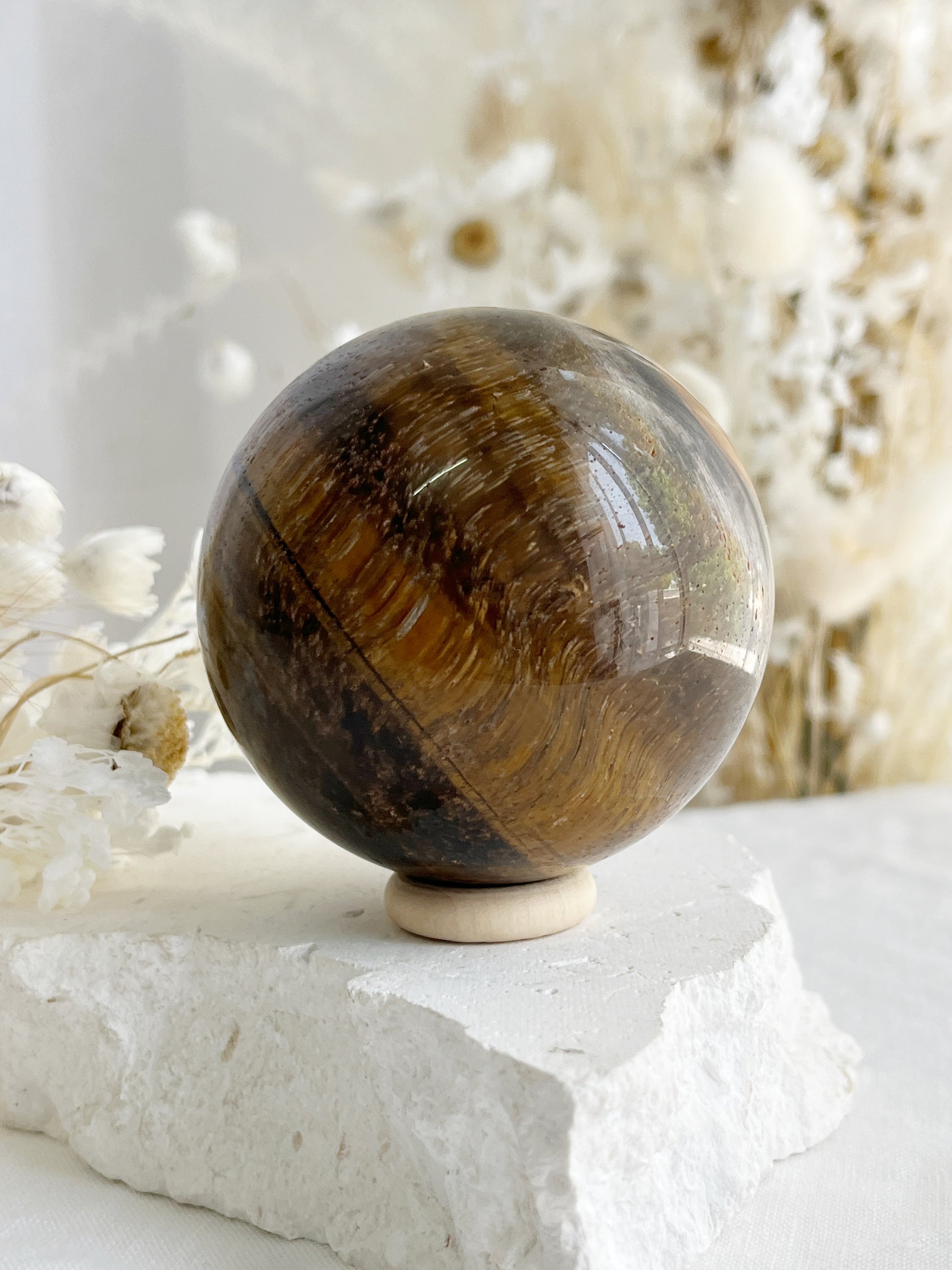 TIGERS EYE SPHERE APPROX 6.4CM. STONED AND SAGED AUSTRALIA.