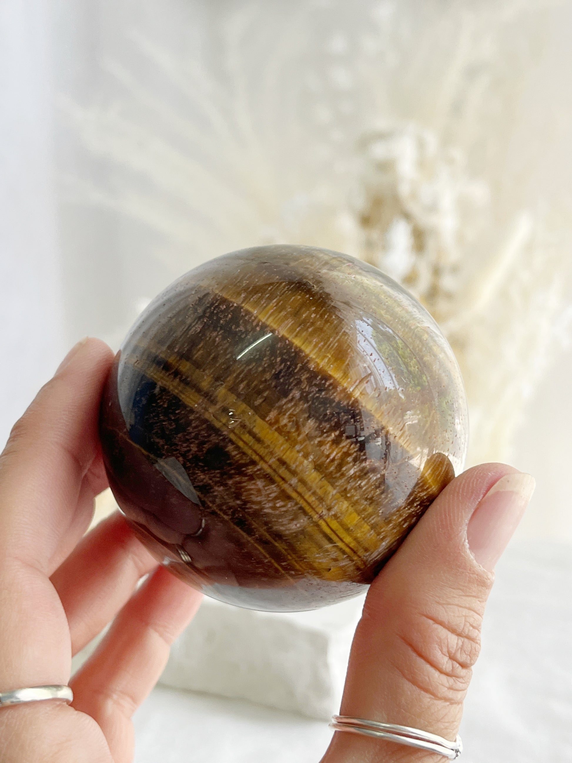 TIGERS EYE SPHERE APPROX 6.4CM. STONED AND SAGED AUSTRALIA.