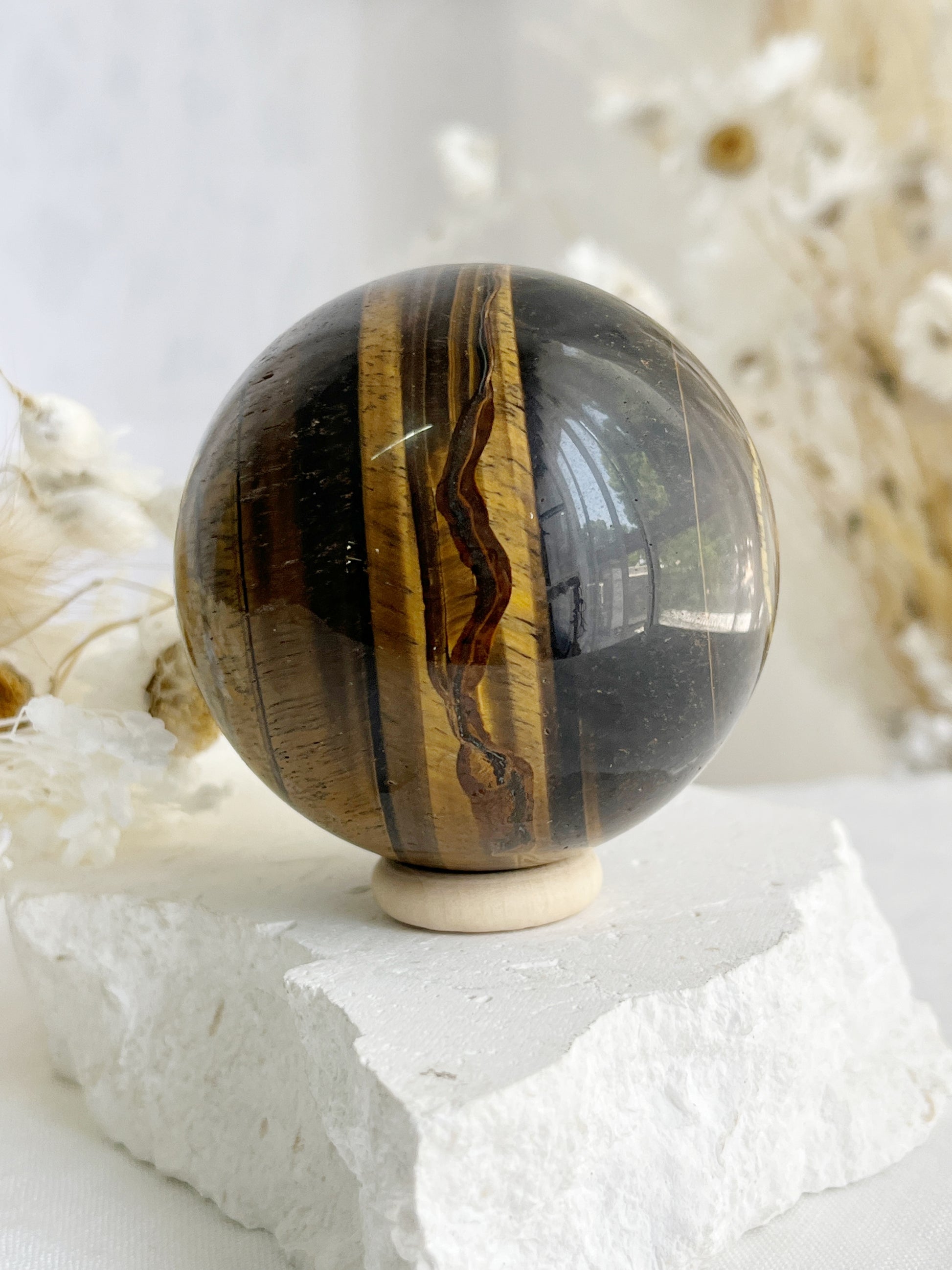 TIGERS EYE SPHERE APPROX 6.1CM. STONED AND SAGED AUSTRALIA.