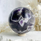 DREAM AMETHYST SPHERE APPROX 7.9CM. STONED AND SAGED AUSTRALIA.