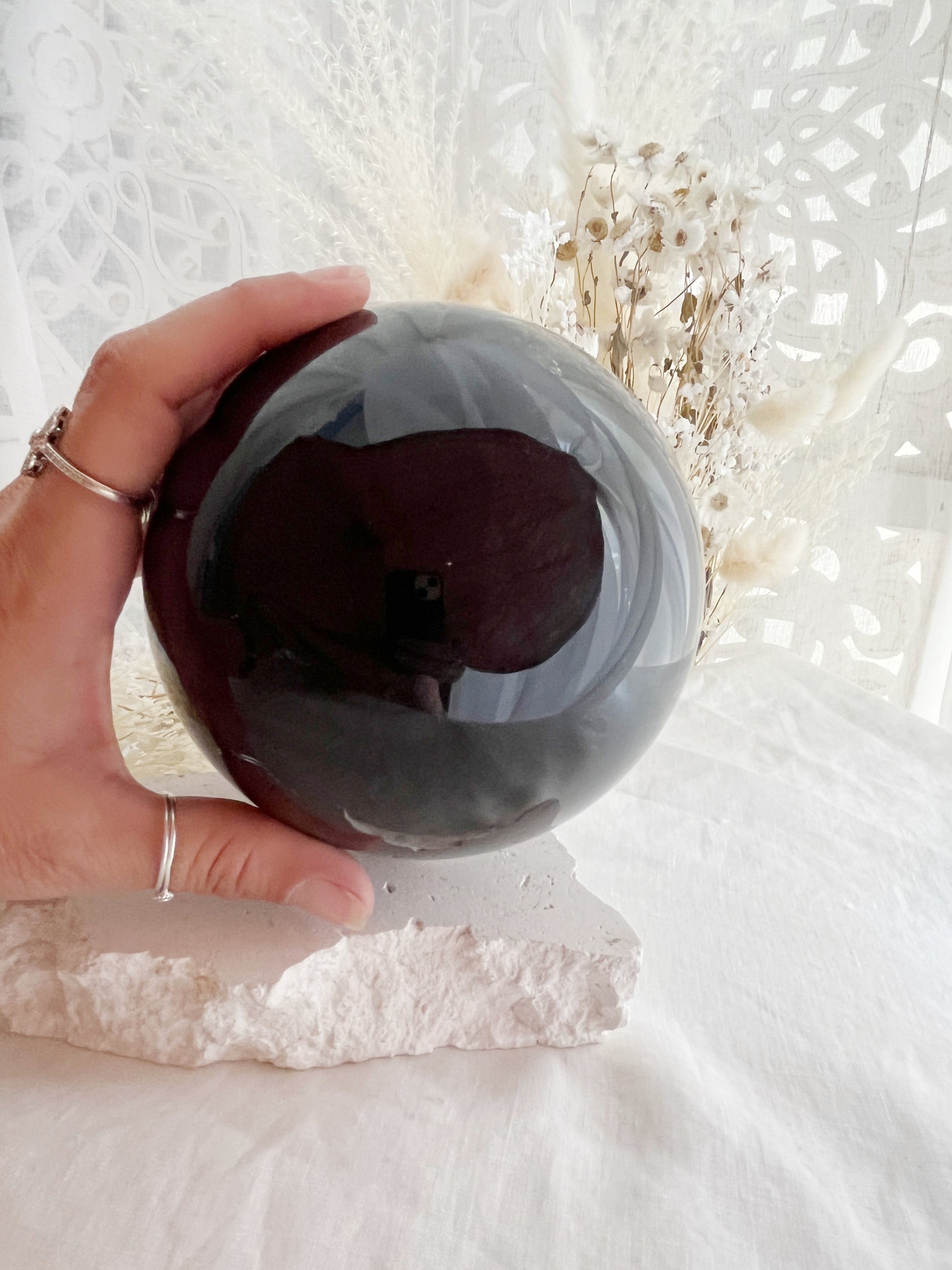 BLACK OBSIDIAN SPHERE APPROX 11.5CM. STONED AND SAGED AUSTRALIA.