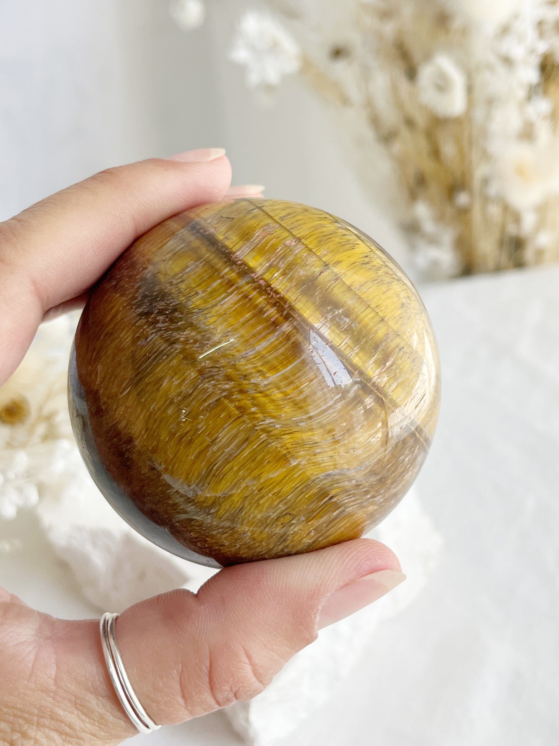 TIGERS EYE SPHERE APPROX 6.4CM. STONED AND SAGED AUSTRALIA.