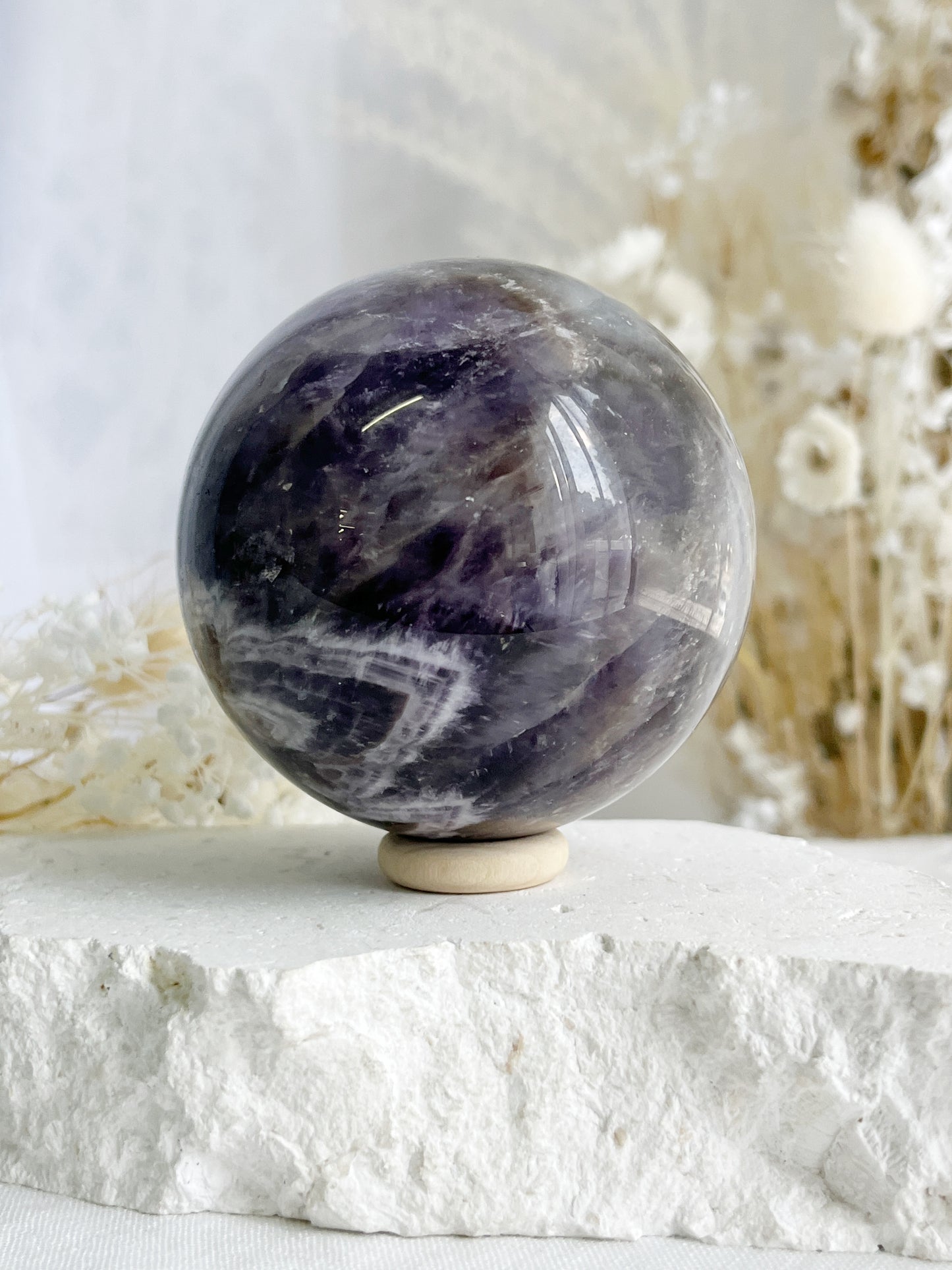 DREAM AMETHYST SPHERE APPROX 7CM. STONED AND SAGED AUSTRALIA.