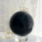 BLACK OBSIDIAN SPHERE. APPROX 9.5 CM. STONED AND SAGED AUSTRALIA.