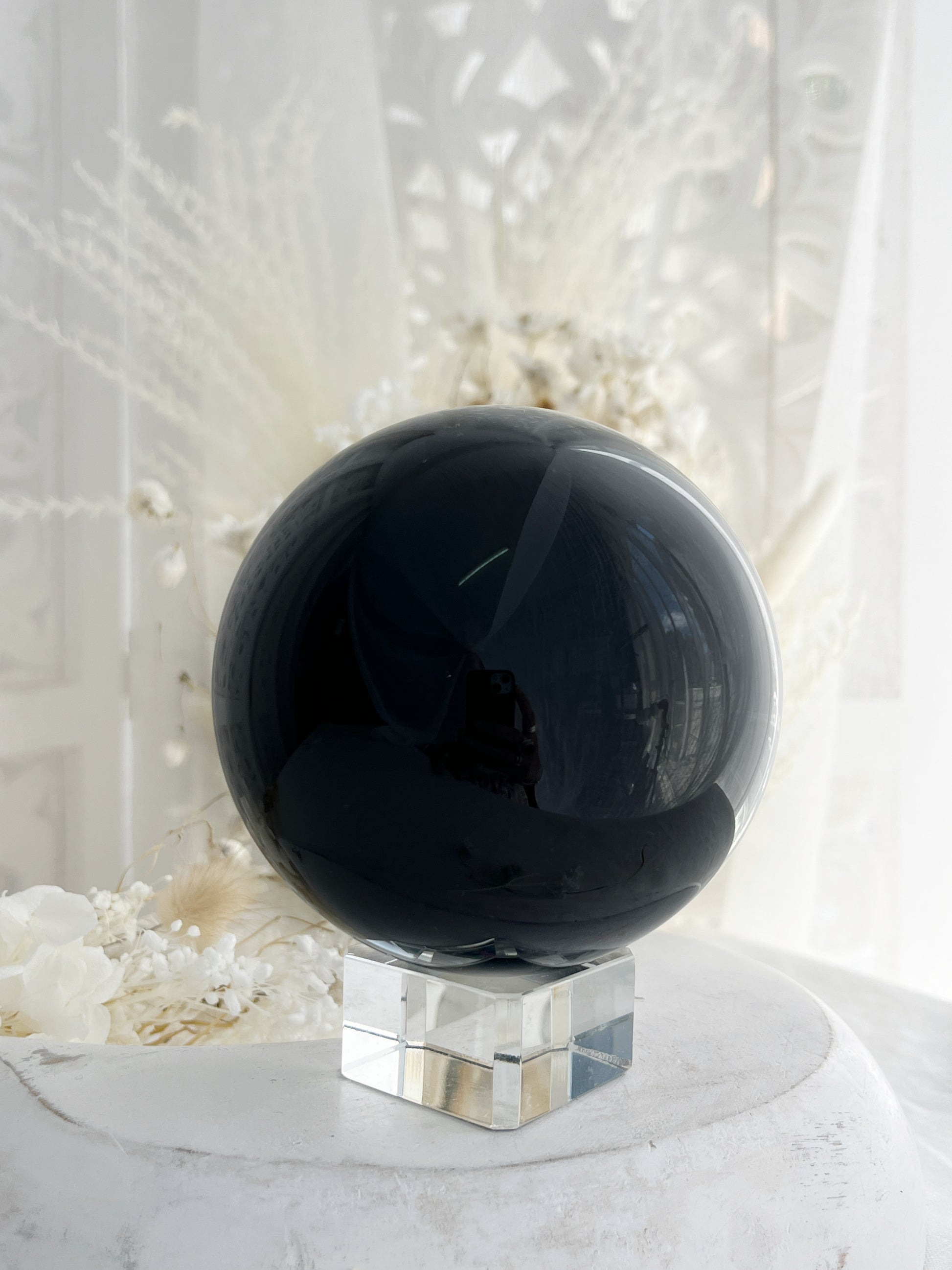 BLACK OBSIDIAN SPHERE. APPROX 9.5 CM. STONED AND SAGED AUSTRALIA.