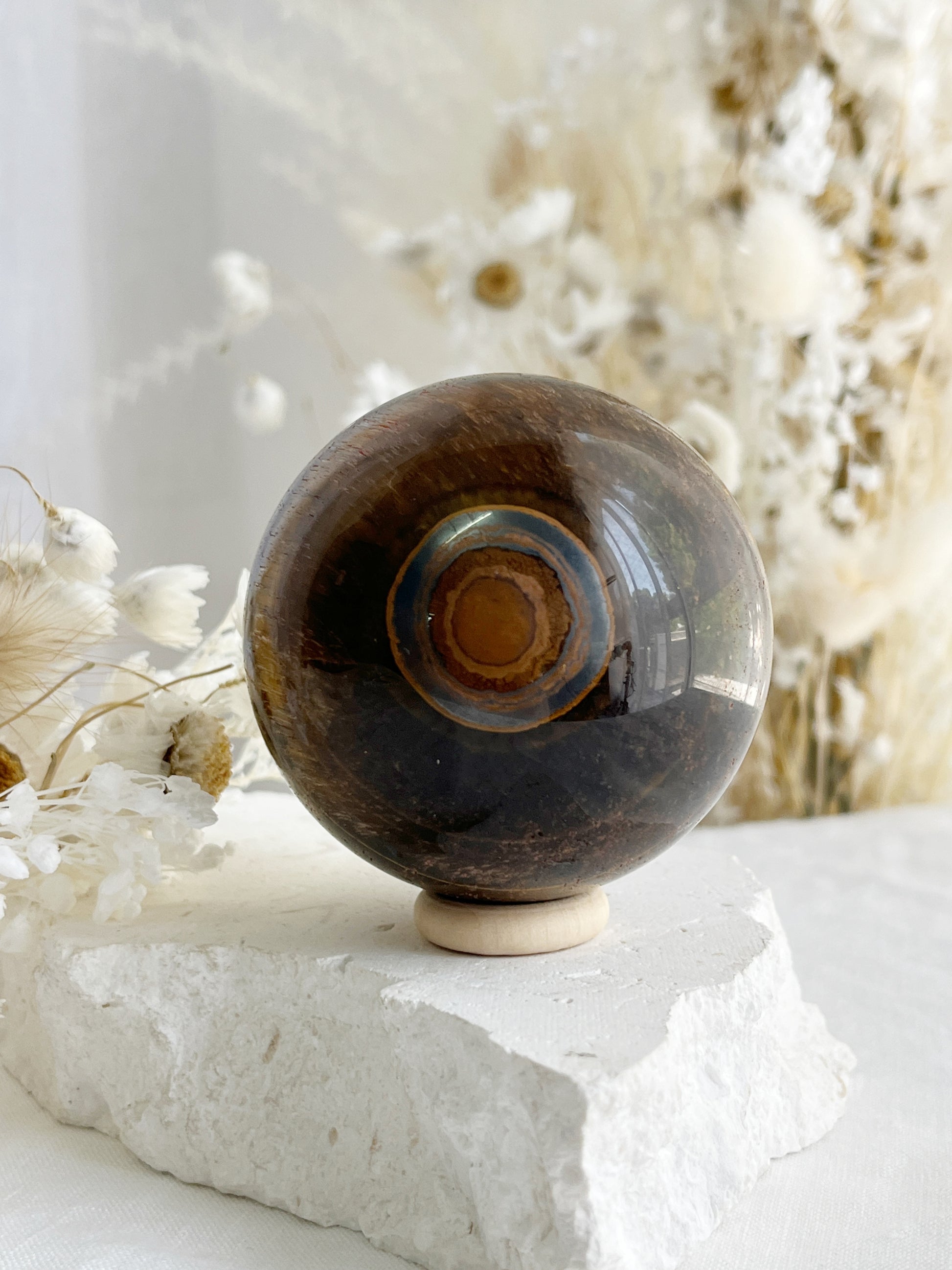 TIGERS EYE SPHERE APPROX 6.4CM. STONED AND SAGED AUSTRALIA.