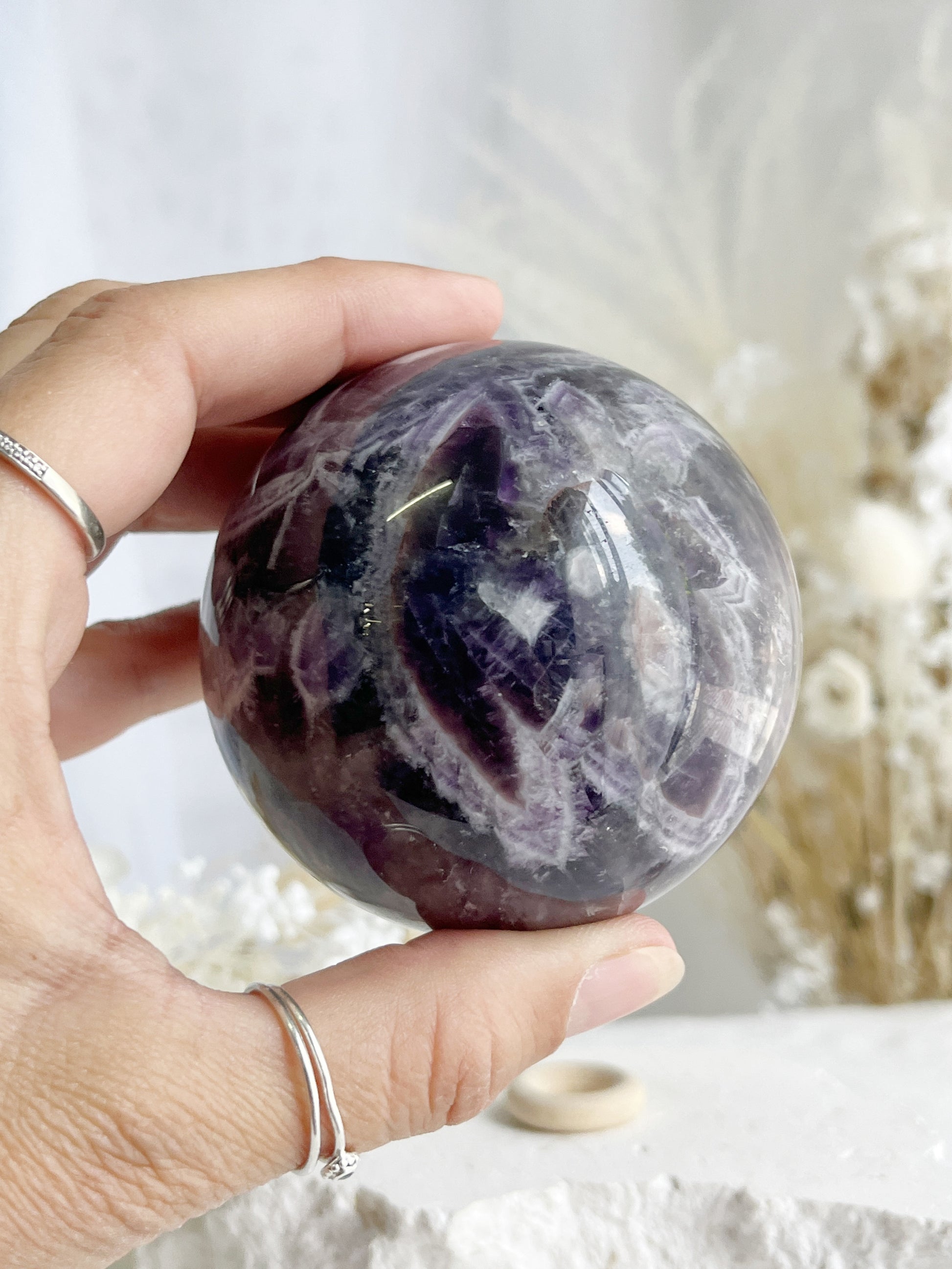 DREAM AMETHYST SPHERE APPROX 7CM. STONED AND SAGED AUSTRALIA.