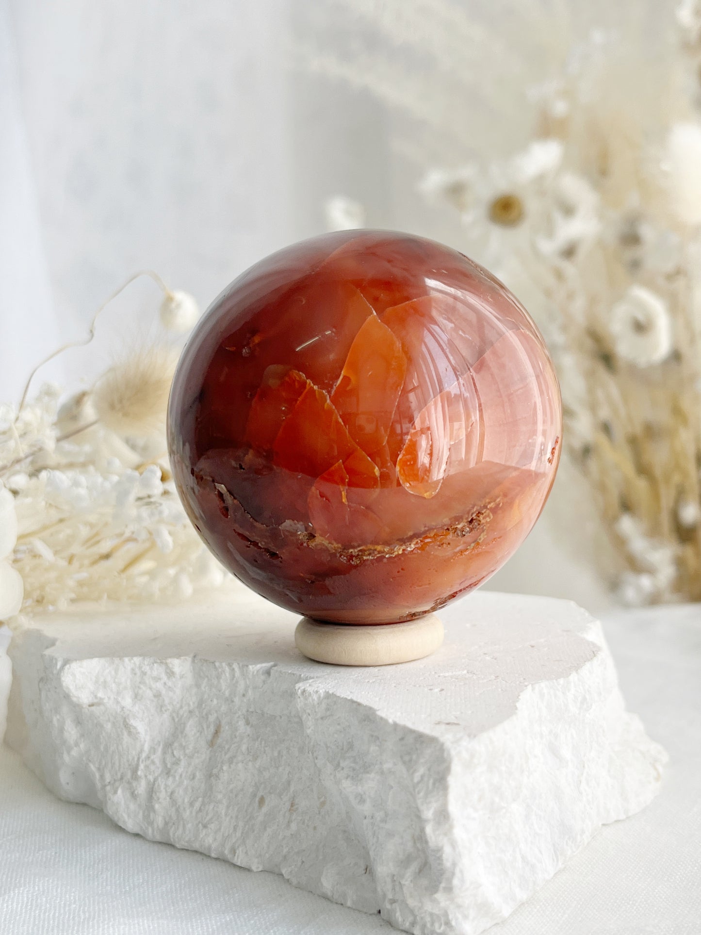 CARNELIAN SPHERE APPROX 6.1CM. STONED AND SAGED AUSTRALIA.