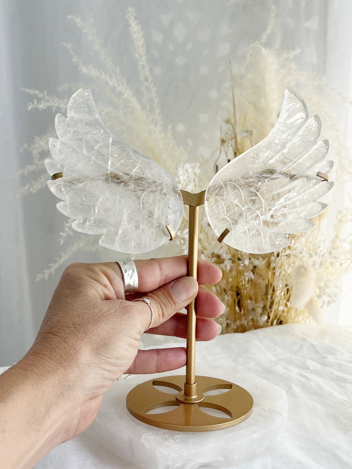 Clear Quartz angel wings on gold stand, Stoned and Saged crystal shop Australia